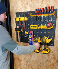 Man Placing Drill onto Nukeson Tool Wall